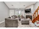 Spacious living room with fireplace and vaulted ceilings at 1148 S Ventura Cir # E, Aurora, CO 80017