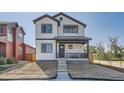 Two-story craftsman style home with white and black accents and a front porch at 305 W Charles St, Superior, CO 80027
