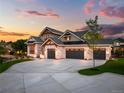 Stunning luxury home with a large driveway and landscaped yard at 6551 S Harlan Ct, Littleton, CO 80123