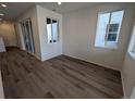 Bright living room with hardwood floors and sliding glass doors at 8487 Eagle River St, Littleton, CO 80125