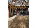Brick front porch with railing and entryway at 5941 S Quail Way, Littleton, CO 80127