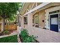 Brick front porch with seating and landscaping at 5 S Logan St, Denver, CO 80209