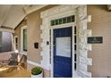 Blue front door with a glass panel in a craftsman home at 5 S Logan St, Denver, CO 80209