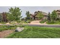 Beautiful neighborhood with mature trees and well-maintained homes at 711 Hiddenbrook Ct, Highlands Ranch, CO 80126