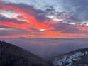 Breathtaking aerial view showcasing a dramatic sunset over a valley at 6057 Red Hill Rd, Boulder, CO 80302