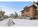 Brick two-story home with snow covered yard and street view at 1260 N Garfield St, Denver, CO 80206