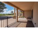 Covered deck with mountain views and a fenced yard at 10690 County Road 1, Longmont, CO 80504