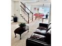 Living room with carpeted floors and dining area at 21030 E 39Th Ave, Denver, CO 80249