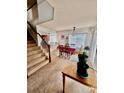 Dining area with table and chairs, view of stairs and kitchen at 21030 E 39Th Ave, Denver, CO 80249