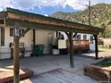 Covered patio with access to a lift and side yard at 427 Idaho St, Idaho Springs, CO 80452