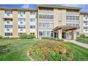 Exterior view of a 3-story apartment building with landscaping at 660 S Alton Way # 7A, Denver, CO 80247