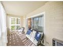 Bright sunroom with comfy seating and sliding glass doors at 660 S Alton Way # 7A, Denver, CO 80247