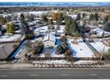 House with a large backyard, snow-covered lawn and a quiet neighborhood at 6101 S University Blvd, Centennial, CO 80121