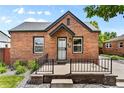 Brick front of house with small porch at 1454 Rosemary St, Denver, CO 80220