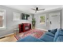 Living room with fireplace and blue sectional sofa at 1454 Rosemary St, Denver, CO 80220