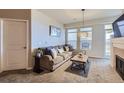 Living room with L-shaped couch and coffee table at 10176 Park Meadows Dr # 2406, Lone Tree, CO 80124