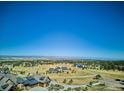 Panoramic aerial view of community and mountains at 8830 Witez Ct, Parker, CO 80134