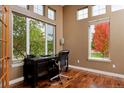 Home office with hardwood floors and large windows at 14022 E Fair Pl, Centennial, CO 80111