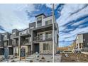 Contemporary townhome showcasing a modern design and balcony at 1753 Peak Loop, Broomfield, CO 80023