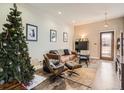 Bright living room with a Christmas tree, comfortable seating, and modern decor at 1056 S Harrison St, Denver, CO 80209