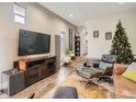 Open concept living area with large TV, comfortable seating, and a modern aesthetic at 1056 S Harrison St, Denver, CO 80209