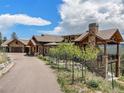 Luxury home with stone and wood accents, mountain views at 456 Crystal Ridge Rd, Evergreen, CO 80439