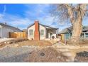 Recently updated bungalow with a brick chimney at 1517 W Nevada Pl, Denver, CO 80223