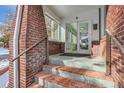 Front entrance with brick steps and tiled flooring at 1048 Garfield St, Denver, CO 80206