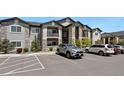 Apartment building with parking and landscaping at 875 E 78Th Ave # 53, Denver, CO 80229