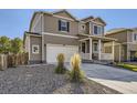 Two-story house with a two-car garage and front porch at 2412 Valley Sky St, Fort Lupton, CO 80621