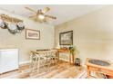 Small dining area with table and chairs, adjacent to kitchen at 309 E Highline Cir # 101, Centennial, CO 80122
