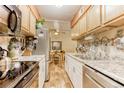 Galley kitchen with stainless steel appliances and granite countertops at 309 E Highline Cir # 101, Centennial, CO 80122