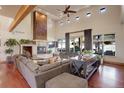 Spacious living room featuring a large sectional sofa and a beautiful stone fireplace at 1919 3Rd Ave, Longmont, CO 80501