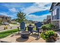 Fire pit and seating area on a flagstone patio at 18352 W 95Th Pl, Arvada, CO 80007