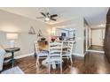 Dining area with wood floors and kitchen access, perfect for entertaining at 1470 S Quebec Way # 27, Denver, CO 80231