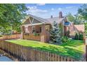 Brick house with a fenced yard and charming details at 501 S Ogden St, Denver, CO 80209