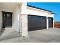 Home exterior showcasing the front entrance and garage at 23845 E River Front Dr, Aurora, CO 80019