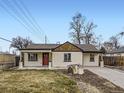 Remodeled craftsman home with a red door, and a spacious yard at 3460 Birch St, Denver, CO 80207