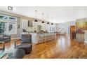 Spacious kitchen boasts modern appliances and an island with seating at 15932 Deer Ridge Dr, Morrison, CO 80465