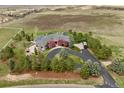 Luxury home with circular driveway, pool, and expansive grounds at 9983 Heather Dr, Castle Rock, CO 80108