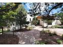 Landscaped front yard with a stone path leading to a modern home's entrance at 3823 Castle Butte, Castle Rock, CO 80109