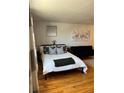 Bedroom with a queen-size bed, hardwood floors, and artwork on the walls at 1350 Josephine St # 403, Denver, CO 80206