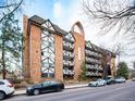 Front view of a brick apartment building with Tudor-style architecture at 1350 Josephine St # 403, Denver, CO 80206