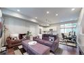 Open concept living room with modern furniture and kitchen access at 2815 W 25Th Ave # 2, Denver, CO 80211
