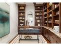 Spacious home office with built-in bookshelves and hardwood floors at 100 Detroit St # 406, Denver, CO 80206