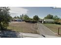 Vacant lot with a residential neighborhood nearby at 971 S Wolff St, Denver, CO 80219