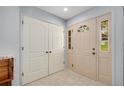 Bright entryway with double closets and neutral-toned doors at 569 S Xenon Ct, Lakewood, CO 80228