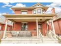 Two-story home with a large porch, classic details and brick facade at 3360 W 31St Ave, Denver, CO 80211