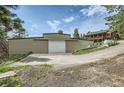 Large metal building with a spacious garage door at 6474 Lone Eagle Rd, Golden, CO 80403