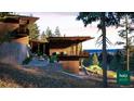 Contemporary home with hillside and forest views at 7 Canyon Pines Dr, Arvada, CO 80403
